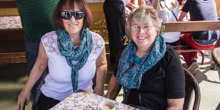 Joyce and Karen show off their new scarves purchased from street vendors in Varenna.