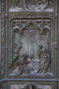 Detail of the carving on the door of the cathedral in Milan. In this picture, an angel has come with a message or gift to the person (Zachariah?) standing on the right. You can see God's presence in the form of the dove at the top.