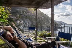 Taking a break from our vacation with my best friend in Vernazza, on the cliffside terrace.