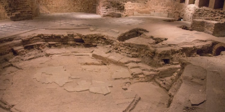 At the back of the church was an entrance to the basement. But this church basement held history, not potlucks. The remains of an ancient baptismal area have been preserved here. Note the octagonal shape - characteristic of baptismal pools.
